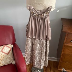 Beautiful sleeveless evening dress in a champagne color.